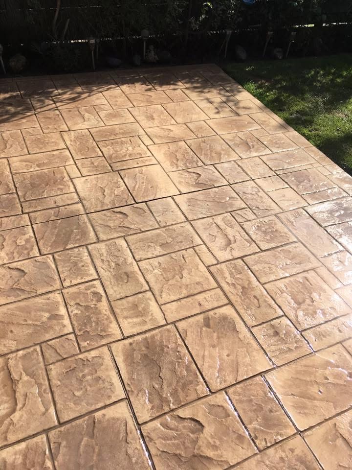 Buff Ashlar pattern imprinted patio in Essex